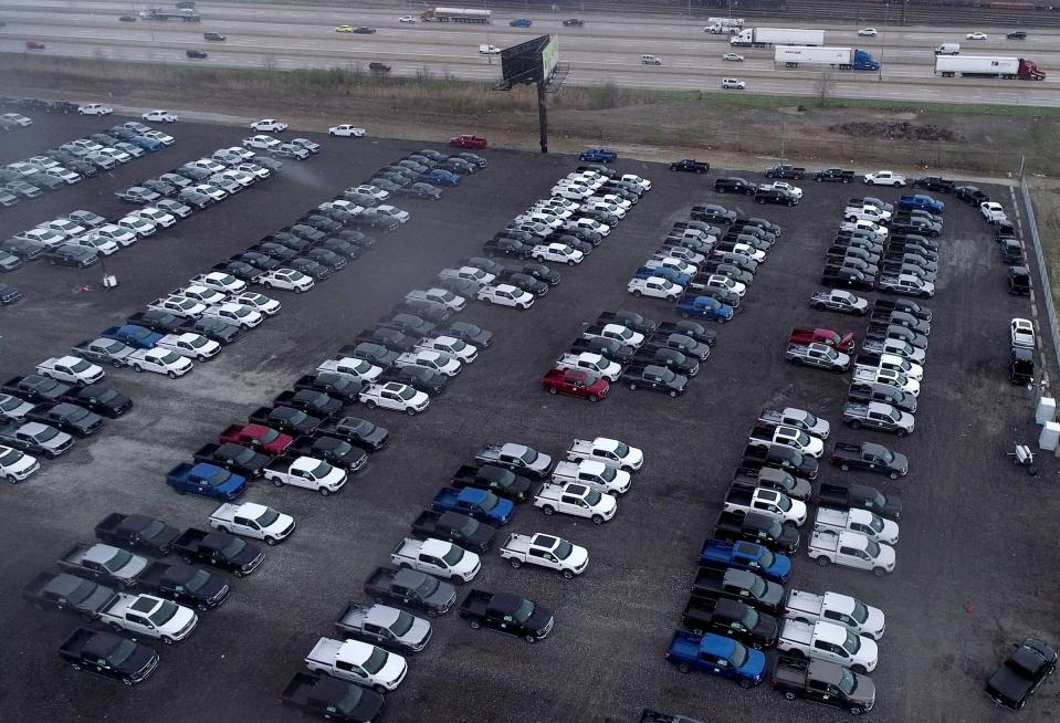 New Ford F-150 pickup trucks sit on a lot of the Department of Public Works rail yard off Interstate 96 near Evergreen in Detroit on April 15, 2021. The trucks are waiting for semiconductors, the company said. Trucks will get quality checks done before being shipping to dealers.