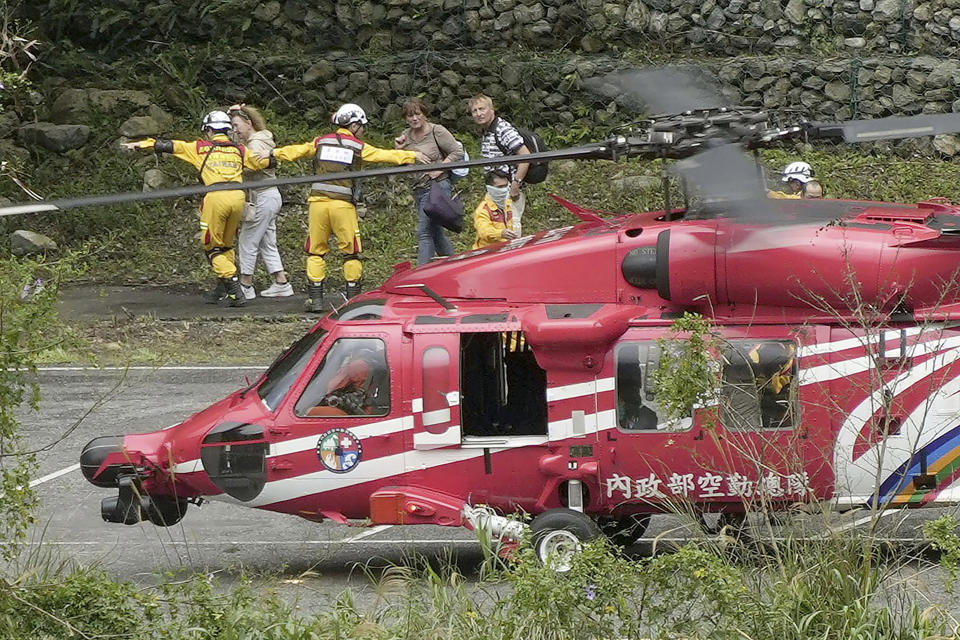 People leave a helicopter after being rescued from an isolated area following a powerful earthquake in Hualien City, Taiwan, Saturday, April 6, 2024. Taiwan’s strongest earthquake in 25 years struck Wednesday morning off its east coast. (Suo Takekuma/Kyodo News via AP)
