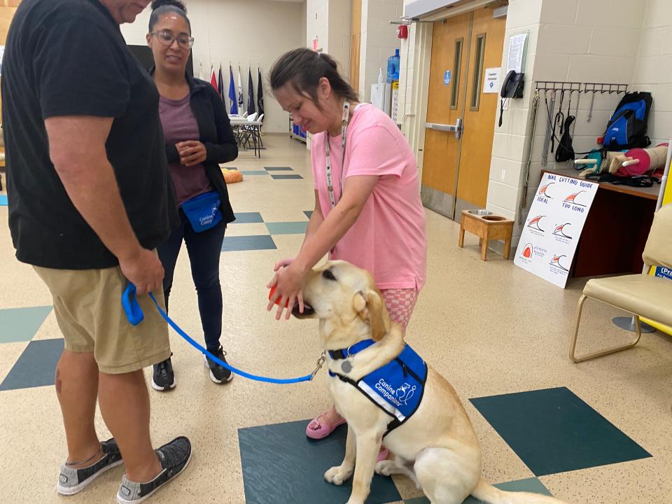 Jazmin Tinsley, 23, of Rehoboth Beach, training with her service dog, Bonus, whom she received from Canine Companions to help with her disabilities.