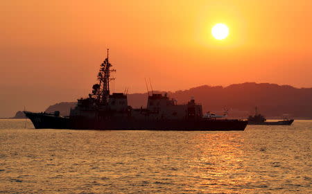 Japanese vessels are seen off Genkaijima Island, north of Fukuoka on Japan's southwestern island of Kyushu in this March 21, 2005 file photo. REUTERS/Kimimasa Mayama/Files