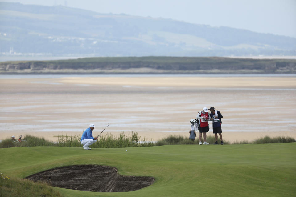 Poland's Adrian Meronk lines up his putt on the 17th green on the first day of the British Open Golf Championships at the Royal Liverpool Golf Club in Hoylake, England, Thursday, July 20, 2023. (AP Photo/Peter Morrison)