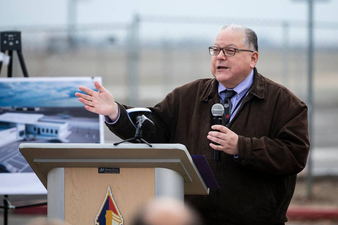 Merced Deputy City Manager Frank Quintero speaks during a groundbreaking ceremony for a $17 million dollar airport terminal replacement project at the Merced Yosemite Regional Airport in Merced, Calif., on Thursday, Dec. 21, 2023. The project will include updates to the existing 1940s-era terminal as well as the construction of a new energy-efficient and sustainable facility.