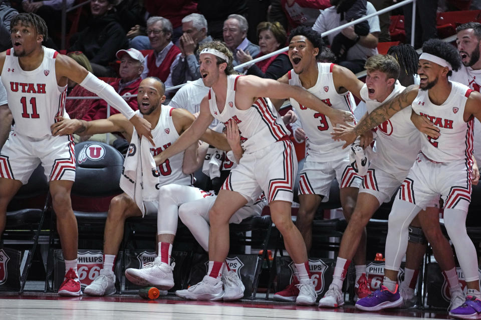 The Utah bench reacts to a score against Arizona during the first half of an NCAA college basketball game Thursday, Dec. 1, 2022, in Salt Lake City. (AP Photo/Rick Bowmer)