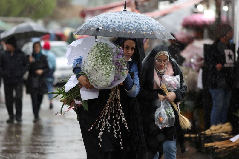 FILE PHOTO: Iranians prepare to celebrate the new year in Tehran