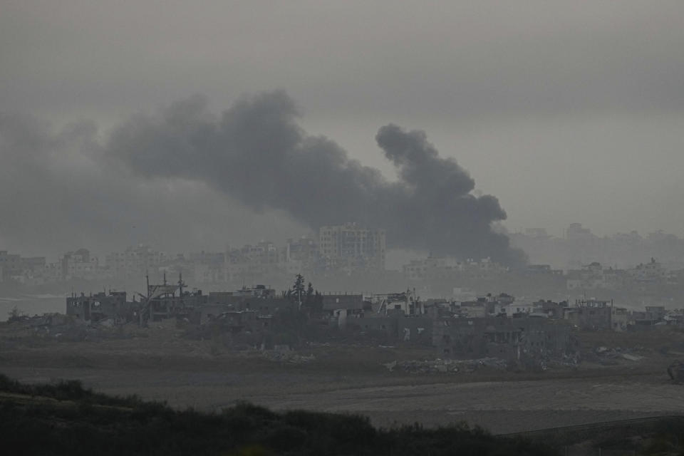 Smoke rises following an Israeli bombardment in the Gaza Strip, as seen from southern Israel on Monday, Dec. 4, 2023. (AP Photo/Ohad Zwigenberg)