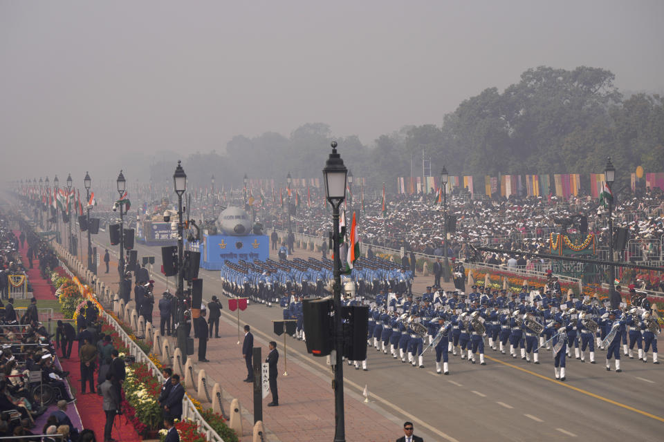 Indian defense forces march through the ceremonial Kartavya Path boulevard during India's Republic Day parade celebrations in New Delhi, India, Friday, Jan. 26, 2024. Thousands of people cheer a colorful parade showcasing India's defense capability and cultural heritage braving a winter chill and mist on a ceremonial boulevard in the Indian capital. (AP Photo/Manish Swarup)