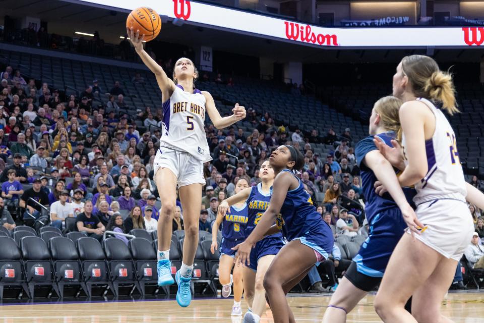 Bret Harte Bullfrogs Ariah Fox (5) makes a layup past Marina Vikings guard Rylee Bradley (23) in the second half in the CIF Division V girls basketball State Championship on Saturday, March 11, 2023, at Golden 1 Center in Sacramento. Fox had a double-double with 22 points and 15 rebounds. The Bullfrogs defeated the Vikings 62-39. (SARA NEVIS/FOR THE RECORD)