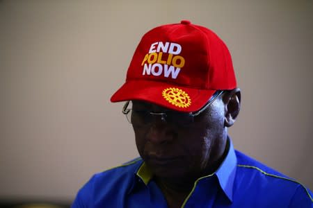 Chairman Nigeria National PolioPlus Committee of Rotary International, Dr. Tunji Funsho wears a cap during a news conference marking the 3-year-polio-free milestone in Abuja