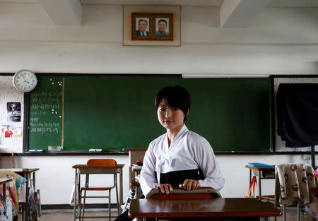 Paeng Yu Na, a high school student at Kanagawa Korean Middle and High School poses for a photograph in her classroom in Yokohama, Kanagawa Prefecture, Japan, June 1, 2018. She is dressed in traditional Korean clothes, the uniform at the school. REUTERS/Kim Kyung-Hoon