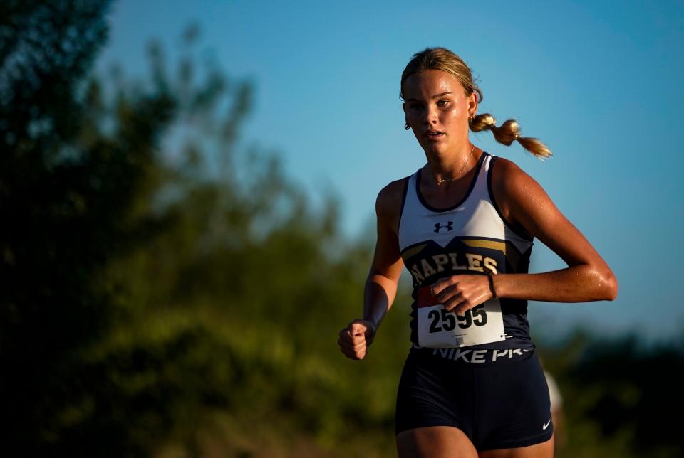 Naples runner Tara Watkins leads the pack as she competes in the Collier County Athletic Conference cross country championship at Palmetto Ridge High School in Naples on Wednesday, Oct. 25, 2023. Watkins took first place to help the team secure first place.