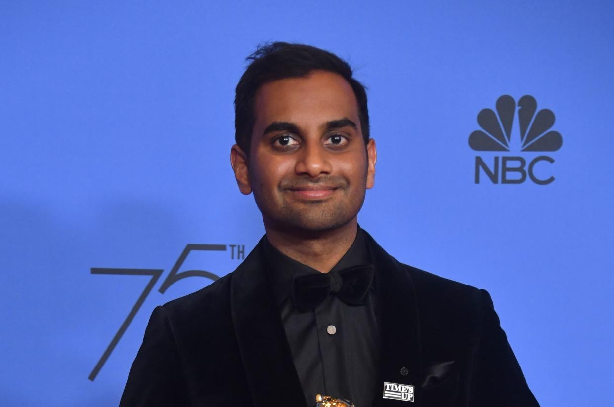 Actor Aziz Ansari, wearing a #TimesUp pin in solidarity with women in Hollywood, acknowledged an encounter with an anonymous accuser but insisted it was “completely consensual.” (Photo: Frederic J. Brown/AFP/Getty Images)