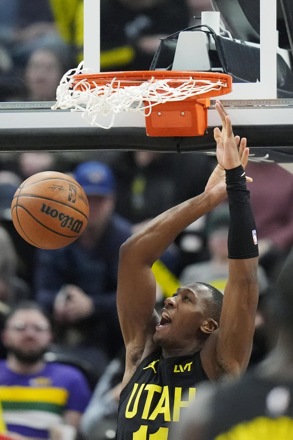 FILE - Utah Jazz guard Kris Dunn dunks against the Toronto Raptors during the second half of an NBA basketball game Friday, Jan. 12, 2024, in Salt Lake City. Since mid-December, the Jazz have ranked in the top 10 among NBA teams in offensive rating and in the top 15 in the league in defensive rating. One factor quietly keying the surge has been the steady play of point guard Kris Dunn. (AP Photo/Rick Bowmer, File)