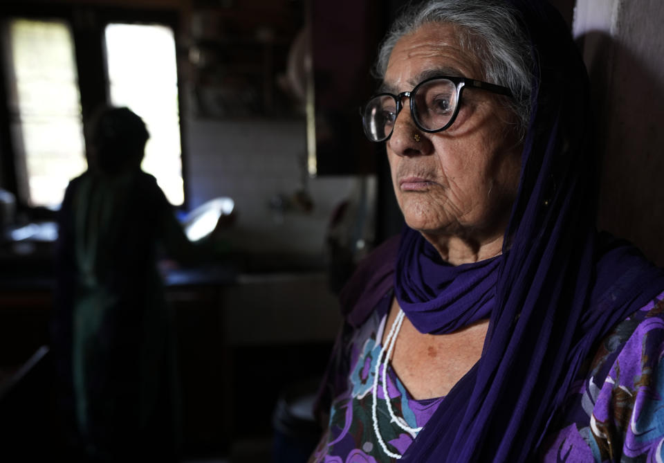 Sharika Pandita, mourns for her son Rakesh Pandita, a leader of the Hindu nationalist Bharatiya Janata Party who was shot dead by assailants in Kashmir, in Jammu, India, June 14, 2022. Kashmir has witnessed a spate of targeted killings in recent months. Several Hindus, including immigrant workers from Indian states, have been killed. (AP Photo/Channi Anand)