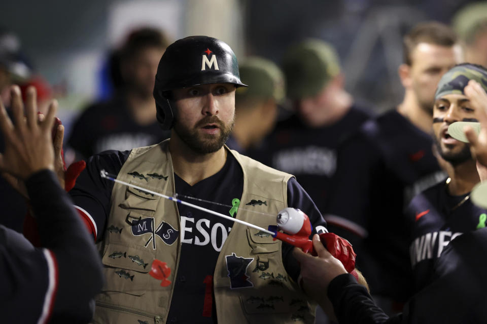 Minnesota Twins first baseman Joey Gallo (13) celebrates with his teammates after hitting a home run during the sixth inning of a baseball game against the Los Angeles Angels in Anaheim, Calif., Saturday, May 20, 2023. (AP Photo/Jessie Alcheh)