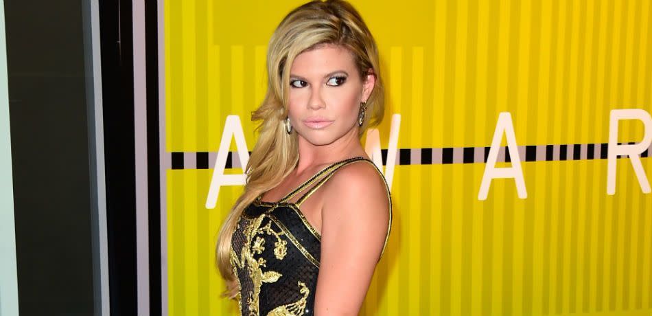 Chanel West Coast poses at an eventChane