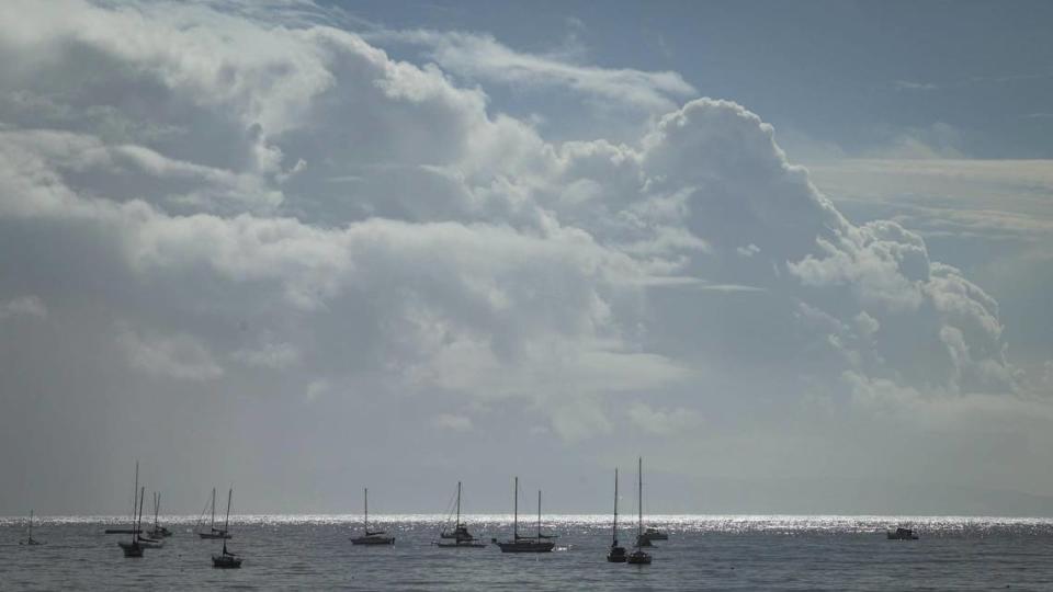 Blue sky and sunshine appears between bands of rain at Port San Luis Harbor on Feb. 5, 2024.