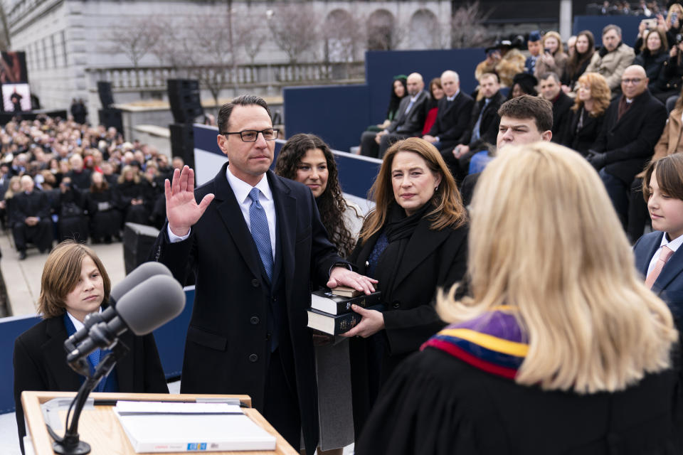 Josh Shapiro accompanied by his wife Lori Shapiro and children, takes the oath of office to become Pennsylvania's 48th governor, administered by Pennsylvania Supreme Court Chief Justice Debra Todd, Tuesday, Jan. 17, 2023, at the state Capitol in Harrisburg, Pa. (AP Photo/Matt Rourke)