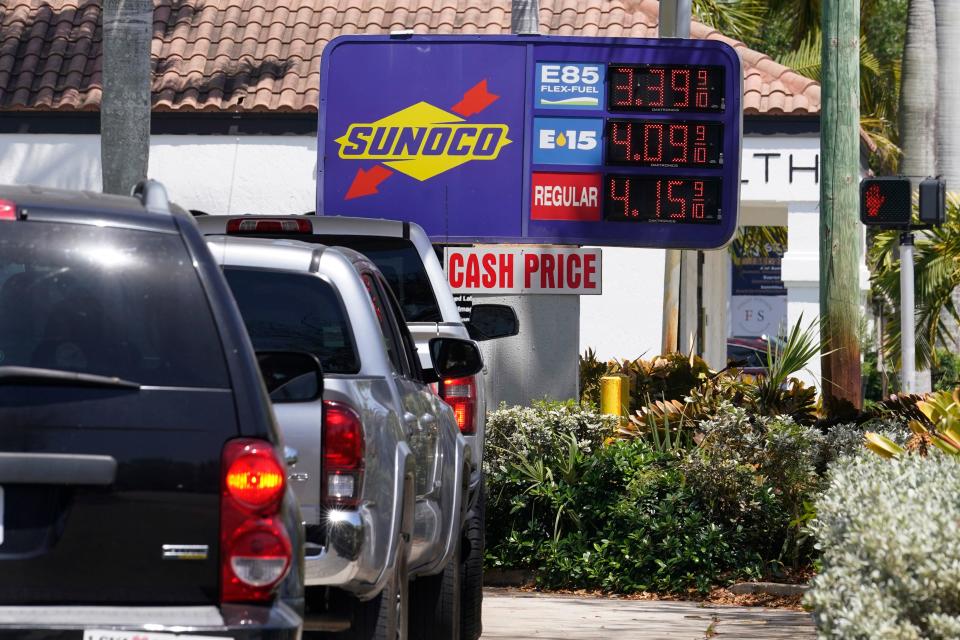 Cars line up at a Sunoco gas station offering high-level ethanol-gasoline blends at a cost below regular gasoline, Wednesday, April 13, 2022, in Delray Beach, Fla.