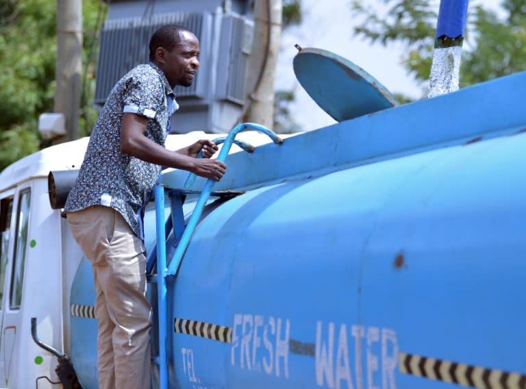 Patrick Kilonzo fills a hired water tanker before embarking on a 70-km journey to deliver the water to thirsty wildlife in the Tsavo West national park, near the town of Voi, around 400km southeast of Kenya's capital Nairobi, on February 24, 2017