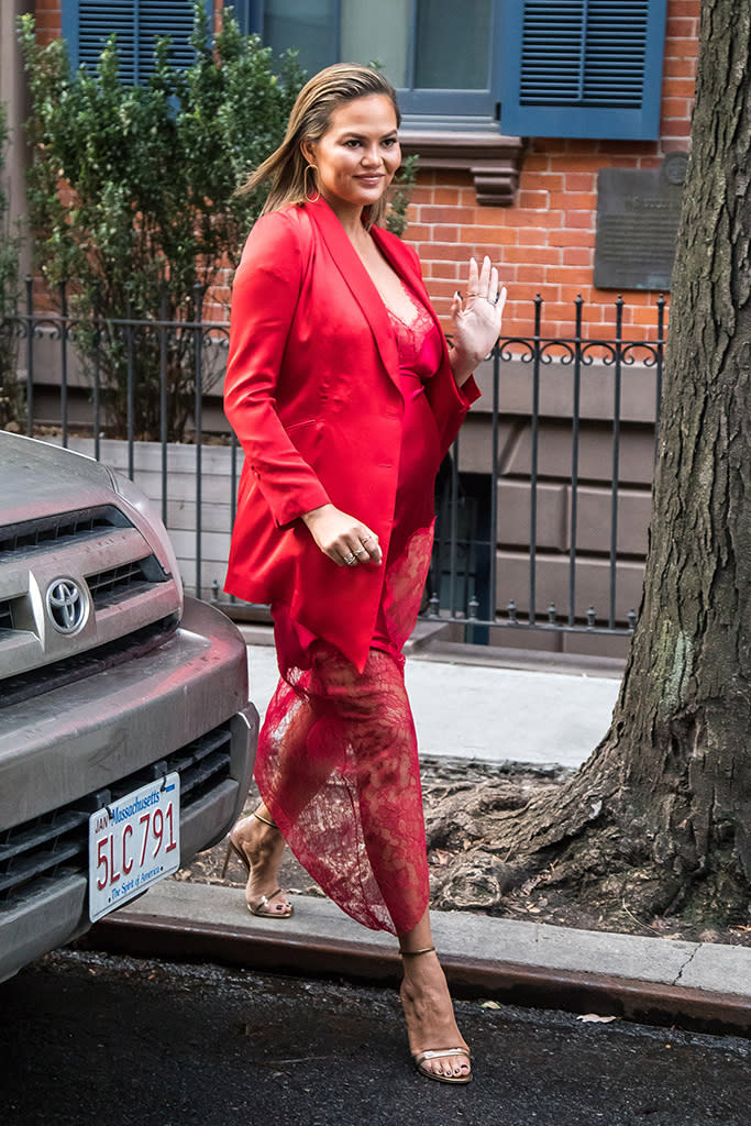 <p>Red-hot mama! The model looked picture-perfect in Christian Siriano, while heading to an appearance on <em>The Tonight Show Starring Jimmy Fallon</em> on Tuesday. Teigen recently revealed that she and her husband, John Legend, are expecting a baby boy. (Photo: Alessio Botticelli/GC Images) </p>