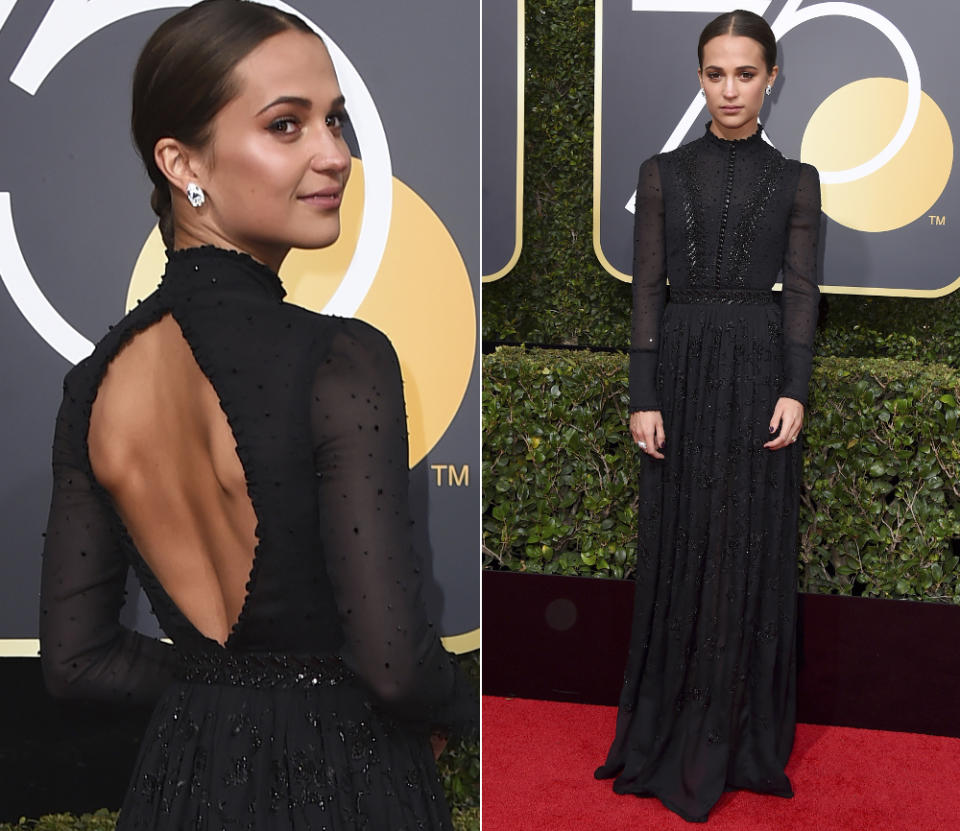 <p>Vorne viktoriansch-schlicht, hinten mit großem Rücken-Entzücken: Alicia Vikander in Louis Vuitton. (Bild: AP) </p>