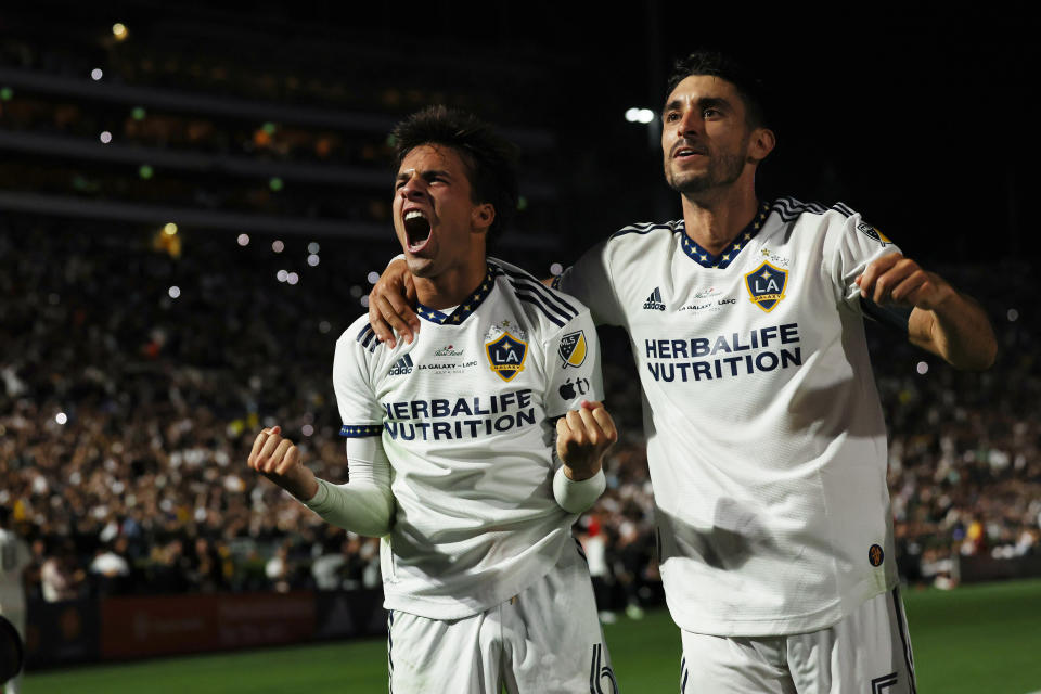 Riqui Puig of LA Galaxy celebrates after scoring the winning goal in an MLS game against LAFC at the Rose Bowl on July 4. (Matthew Ashton - AMA/Getty Images)