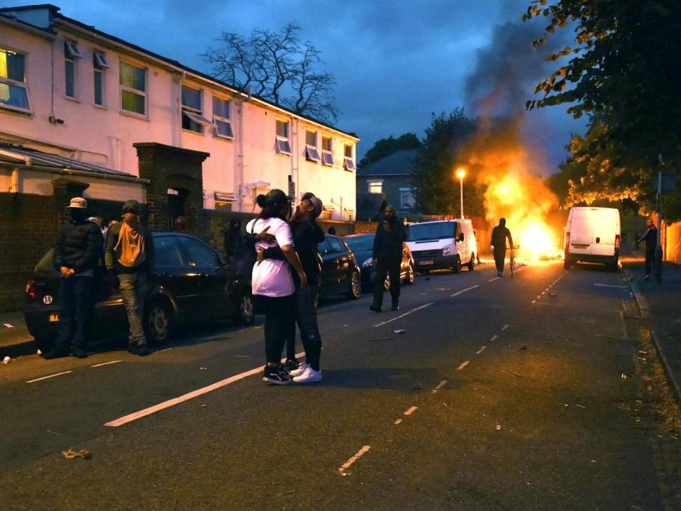 Campaigners face off with police in Richmond Road in Forest Gate, north east London, as they protest over the death of Edir Frederico Da Costa, who died on June 21 six days after he was stopped in a car by Metropolitan Police officers (PA)