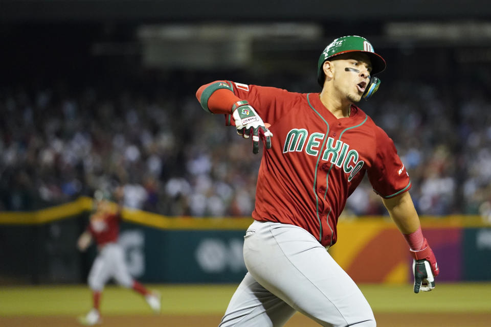 Mexico's Joey Meneses celebrates as he runs the bases after hitting a three-run home run against the United States during the fourth inning of a World Baseball Classic game in Phoenix, Sunday, March 12, 2023. (AP Photo/Godofredo A. Vásquez)