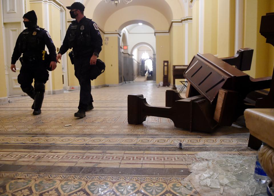 TOPSHOT - Damage is seen inside the US Capitol building early on January 7, 2021 in Washington, DC, after supporters of US President Donald Trump breeched security and entered the building during a session of Congress. - Donald Trump's supporters stormed a session of Congress held today, January 6, to certify Joe Biden's election win, triggering unprecedented chaos and violence at the heart of American democracy and accusations the president was attempting a coup. (Photo by Olivier DOULIERY / AFP) (Photo by OLIVIER DOULIERY/AFP via Getty Images)