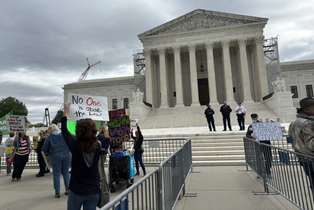 Dozens of anti-Trump protesters gather April 25, 2024, outside the U.S. Supreme Court while the justices hear arguments about whether former President Donald Trump has immunity from prosecution on criminal charges related to his actions while in office.