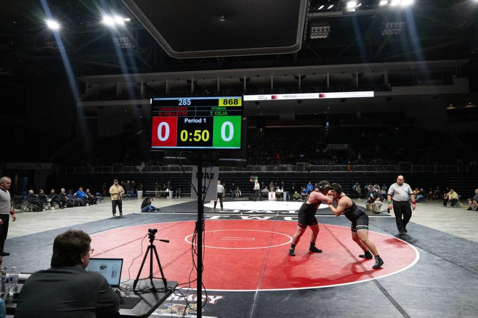 Pitman’s Troy Ceja and Laguna Creek’s Declan Follette battle in the 285-pound title match during the Sac-Joaquin Section Masters Wrestling Championships at Stockton Arena in Stockton, Calif., Saturday, Feb. 17, 2024. Follette won by fall at 3:55.