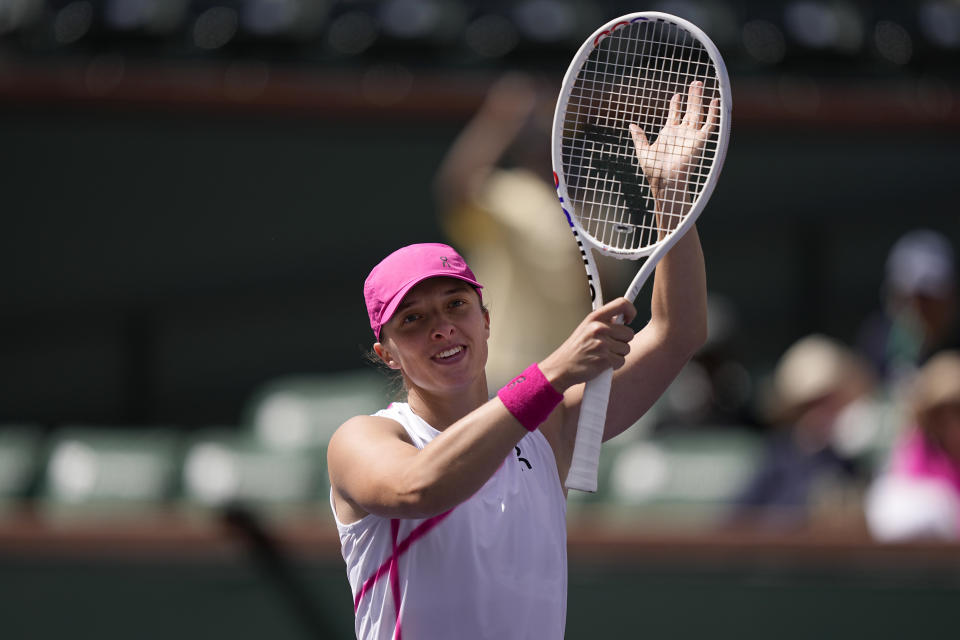 Iga Swiatek, of Poland, celebrates after defeating Linda Noskova, of the Czech Republic, at the BNP Paribas Open tennis tournament in Indian Wells, Calif., Sunday, March 10, 2024. (AP Photo/Mark J. Terrill)