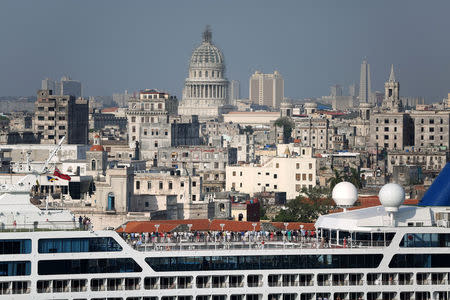 People look at the city of Havana from the deck of U.S. Carnival cruise ship Adonia as it enters at the Havana bay, the first cruise liner to sail between the United States and Cuba since Cuba's 1959 revolution, Cuba, May 2, 2016. REUTERS/Alexandre Meneghini