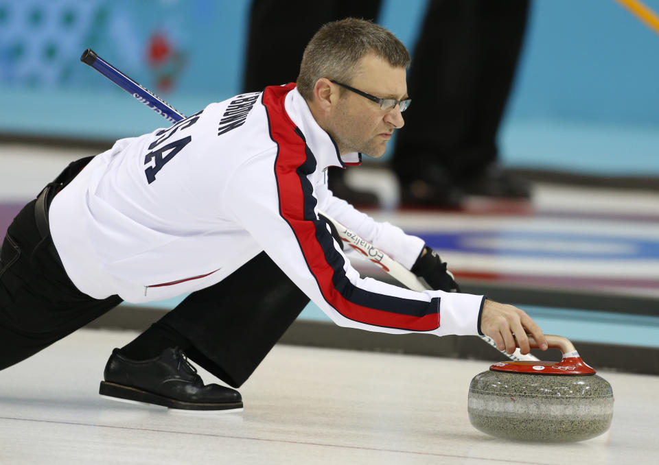 Craig Brown, an alternate on Team USA, delivers the stone during a men's curling training session the 2014 Winter Olympics, Sunday, Feb. 9, 2014, in Sochi, Russia. (AP Photo/Robert F. Bukaty)