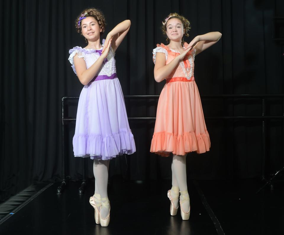 During rehearsal for "The Nutcracker" at Sovereign Ballet, Mia Koket, 13, left, and Andrea Saska, 15, portray Bon Bon dancers.