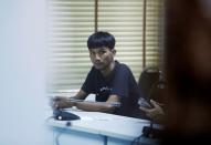 Panupong Jadnok, a pro-democracy student, one of the leaders of Thailand's recent anti-government protests, is pictured after being arrested, at the police station in Bangkok