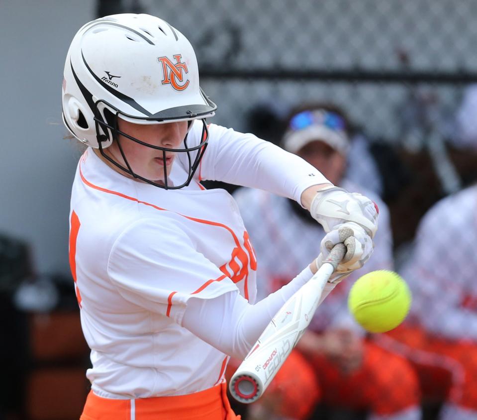 Tess Bucher of Hoover doubles, driving in Lily Conrad, during a home game against Lake, Wednesday, March 31, 2021.