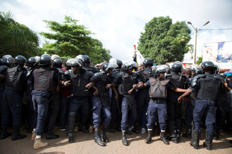 Security forces in Bamako line up to hold back the crowd at Sunday's march in support of President Ibrahim Boubacar Keita