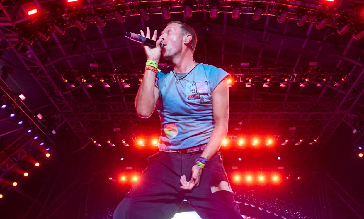<span>Eye-popping performance … Chris Martin performing with Coldplay.</span><span>Photograph: David Levene/The Guardian</span>