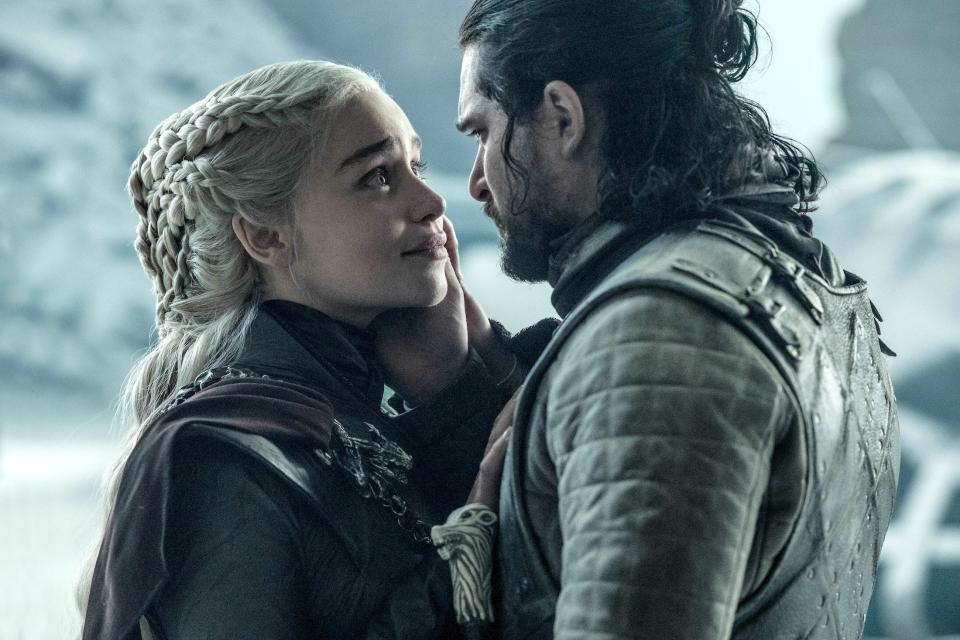 A screenshot from "Game of Thrones" where Jon Snow has his hand pressed against the cheek of Daenerys Targaryen while they are standing outside in a snowy scene.