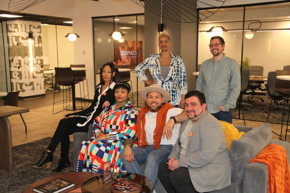 Audible and Equal Space partnership in Newark, NJ. Seated: Angie Albizu, community engagement coordinator for Equal Space; Kelly Outing, community events and engagement manager for Equal Space; Citi Medina, co-founder and CEO of Equal Space; and Ralphie Roman, co-founder and COO of Equal Space. Standing: Aisha Glover, Head of Urban Innovation for Audible; and Ari Fox, Senior Director of Economic Impact for Audible.