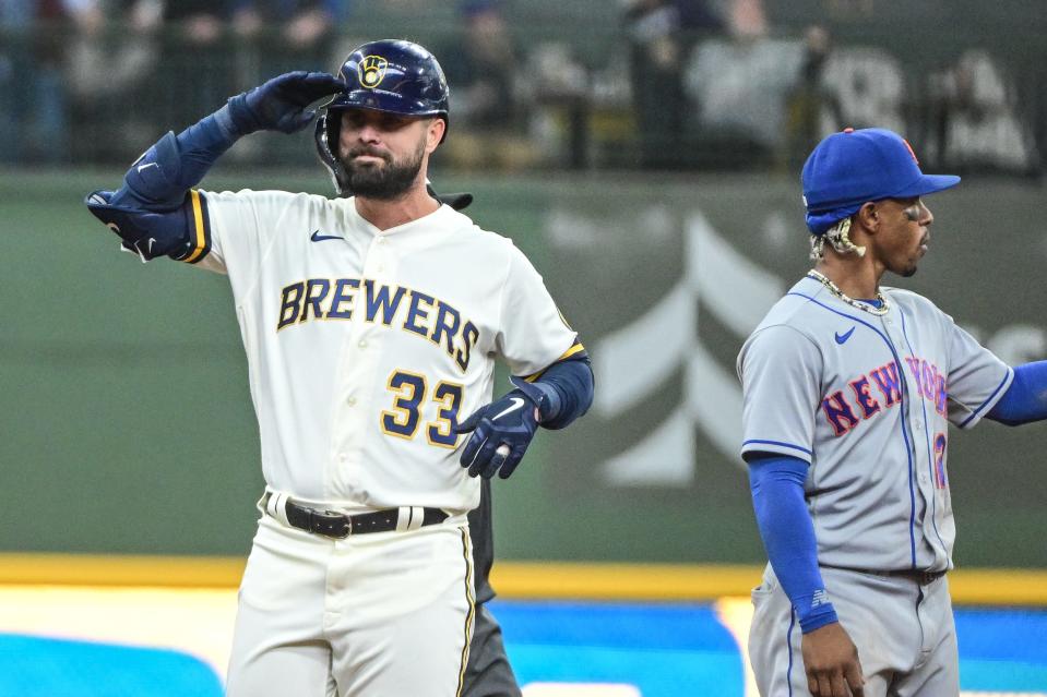 Jesse Winker reacts after hitting a double to drive in two runs against the New York Mets at American Family Field on April 5 in Milwaukee.