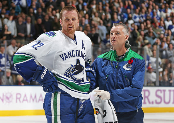 TORONTO, ON - NOVEMBER 5: Daniel Sedin #33 of the Vancouver Canucks gets to his feet after taking a big hit from Nazem Kadri #43 of the Toronto Maple Leafs during an NHL game at the Air Canada Centre on November 5, 2016 in Toronto, Ontario, Canada. The Leafs defeated the Canucks 6-3. (Photo by Claus Andersen/Getty Images)