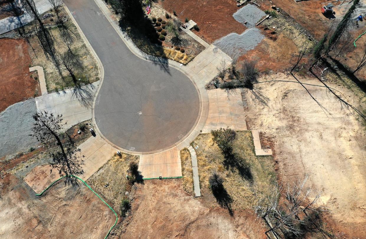 After the 2018 wildfire in Paradise, Calif., many fire-damaged homes were razed. <a href="https://www.gettyimages.com/detail/news-photo/an-aerial-view-of-a-neighborhood-destroyed-by-the-camp-fire-news-photo/1182727469" rel="nofollow noopener" target="_blank" data-ylk="slk:Justin Sullivan/Getty Images;elm:context_link;itc:0;sec:content-canvas" class="link ">Justin Sullivan/Getty Images</a>