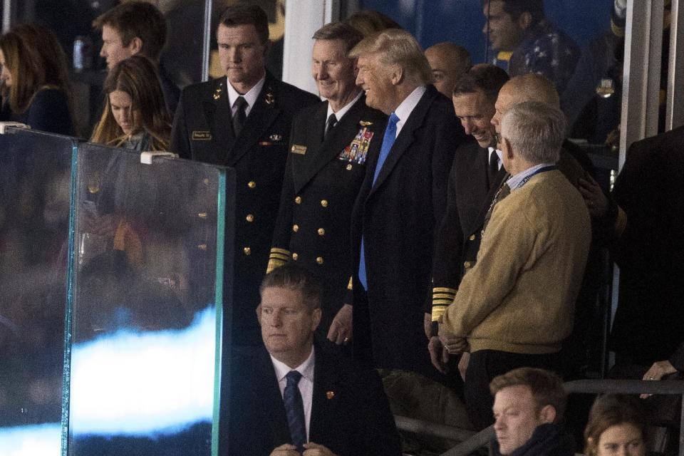 President-elect Donald Trump speaks with members of the military during an Army-Navy NCAA college football game, Saturday, Dec. 10, 2016, in Baltimore. (AP Photo/Andrew Harnik)