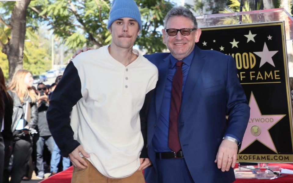 HOLLYWOOD, CALIFORNIA - JANUARY 23: Justin Bieber (L) and Sir Lucian Grainge pose at an event honoring Sir Lucian Grainge with a star on the Hollywood Walk of Fame on January 23, 2020 in Hollywood, California. (Photo by David Livingston/Getty Images) - David Livingston/Getty Images North America