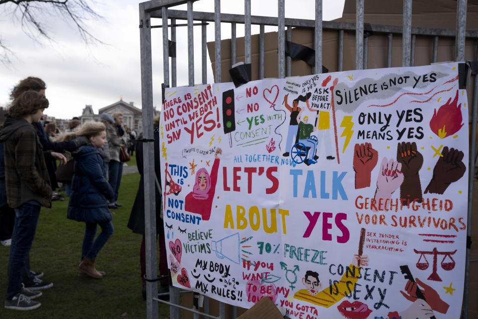 Hundreds of people protested in Amsterdam, Netherlands, Saturday, Jan. 29, 2022, in a #MeToo demonstration sparked by allegations of sexual improprieties linked to a popular Dutch TV talent show. The demonstration on Amsterdam's Museumplein square was organized following reports of inappropriate sexual behavior, ranging from WhatsApp messages to an allegation of rape, linked to "The Voice of Holland." (AP Photo/Peter Dejong)