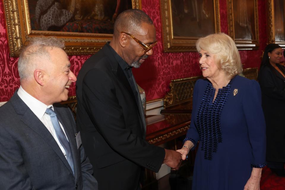 The Queen shakes hands with Sir Lenny Henry during a reception at Buckingham Palace in London with finalists, judges and celebrity readers, to celebrate the final of the BBC’s creative writing competition, 500 Words (Chris Jackson/PA) (PA Wire)
