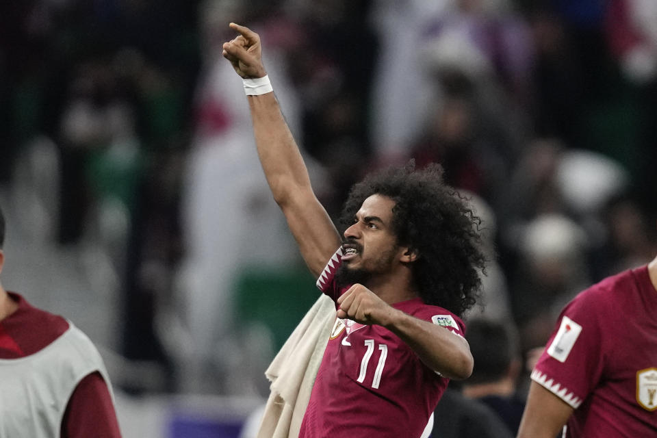 Qatar's Akram Afif celebrates after scoring during the Asian Cup semifinal soccer match between Qatar and Iran at Al Thumama Stadium in Doha, Qatar, Wednesday, Feb. 7, 2024. (AP Photo/Thanassis Stavrakis)