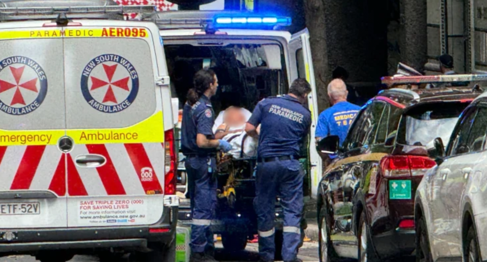 A man being stretchered into a NSW Ambulance after being shot in Sydney on Wednesday. 
